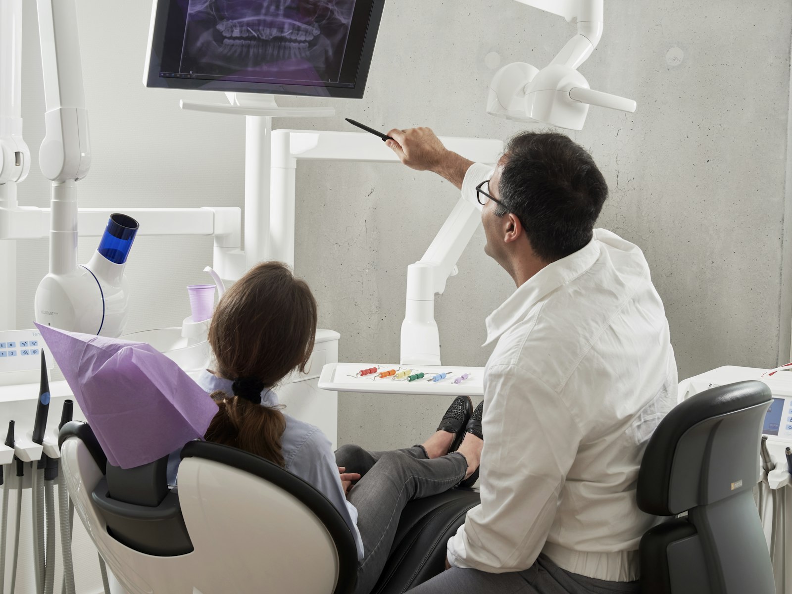 Dentist examining a patient's smile chairside