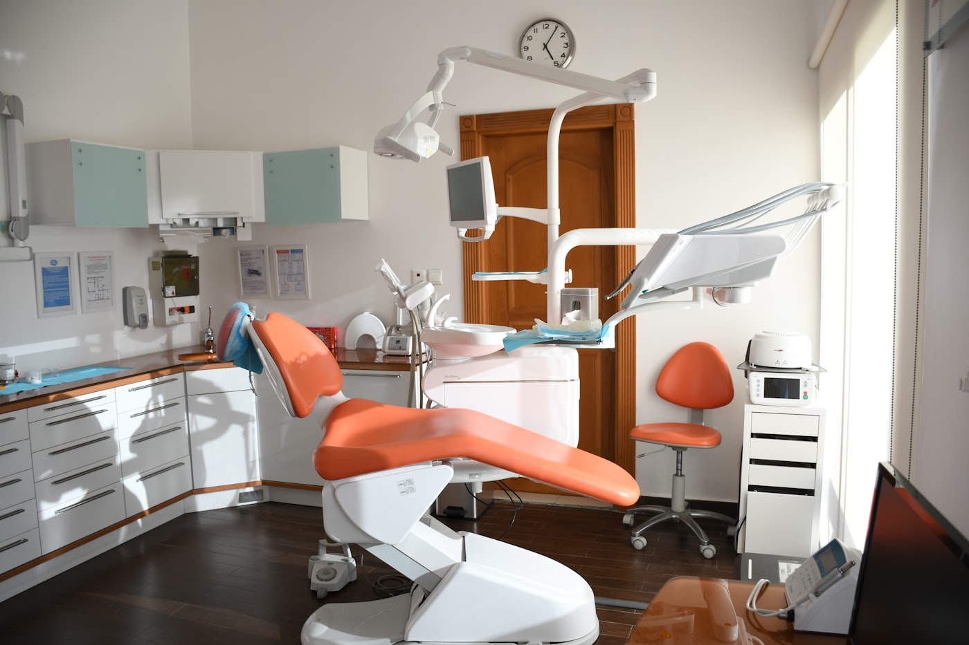 Modern dental treatment chair in a softly lit room