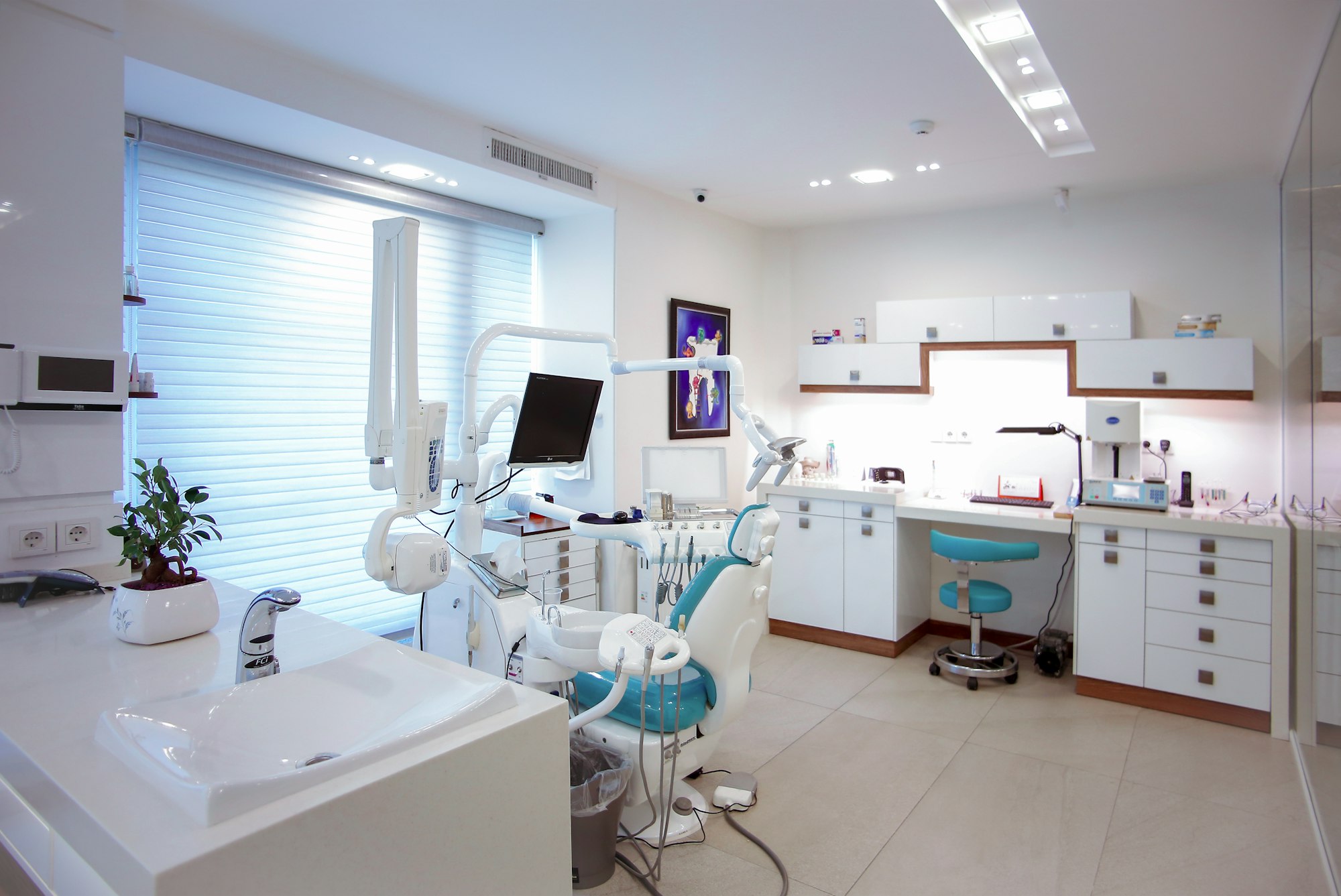 Dentist and assistant working with a patient